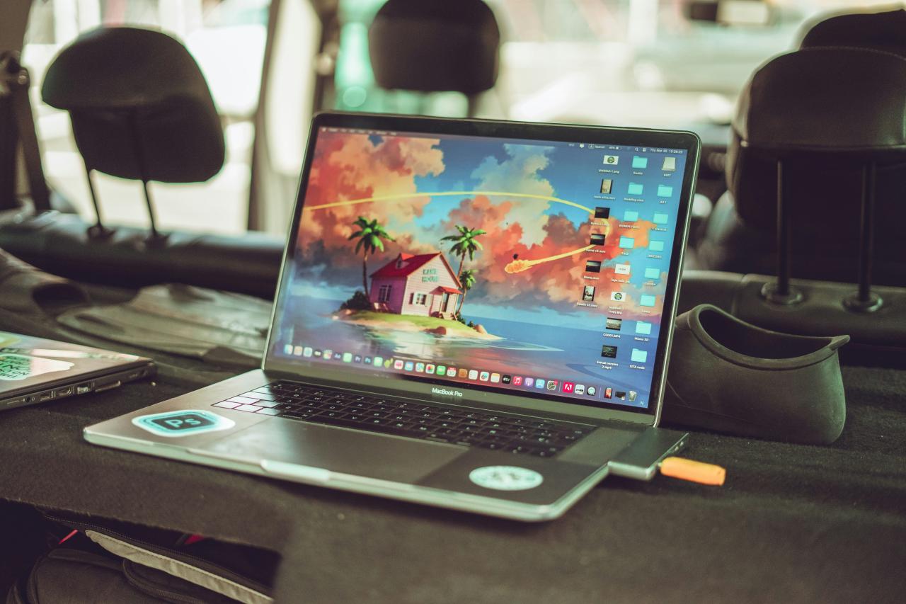 a laptop computer sitting on top of a table